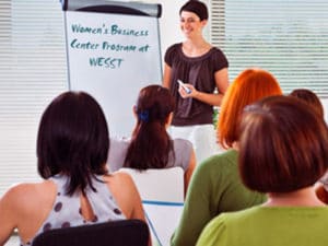 woman teaching with a whiteboard